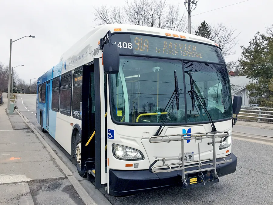 A York Region Transit bus on route 91A Bayview, stopped at the curb with its front door open.